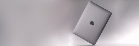 MINSK, BELARUS - DECEMBER 6, 2021: new digital laptop Apple MacBook air on gray background