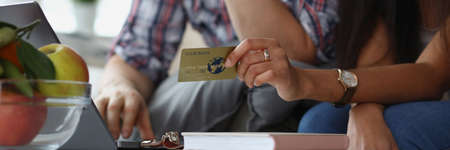 Wife and husband want to buy something online via credit card paymentの写真素材