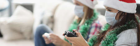 Friends have fun and playing video game using controlling joystick