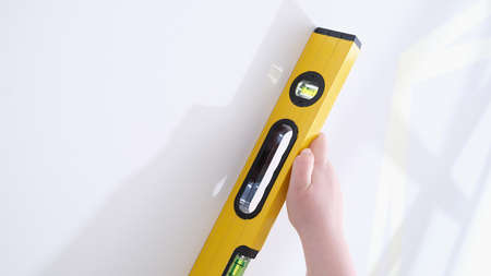 Professional yellow measuring device for level and evenness of wall