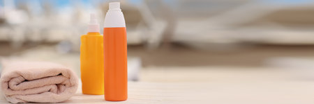 Necessary beach accessories, sunscreen spray, oil, towel, set of things for beach day