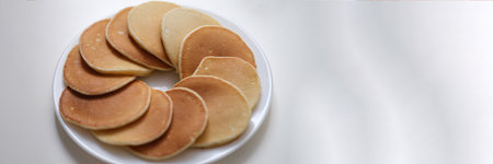 Flour sweet round fritters on white plate closeupの写真素材