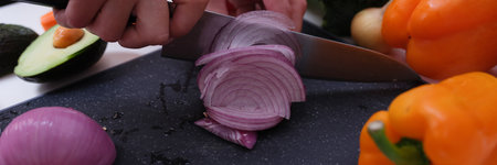 Cutting vegetables red onion and healthy foodの写真素材