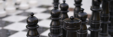 Chess pieces on chessboard. Game strategy and defense conceptの写真素材