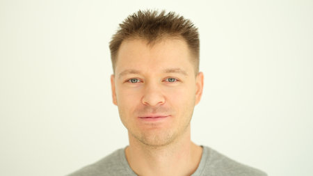 Portrait of young healthy man with stylish haircut