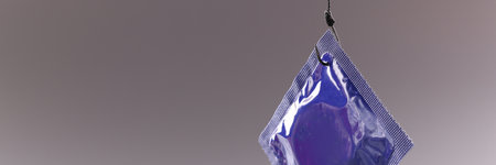 Condom package on a gray background. Safe sex and healthの写真素材