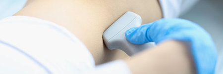 Doctor makes ultrasound diagnosis of patient with kidney prolapseの写真素材
