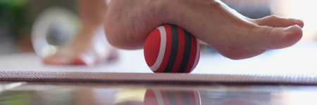 Female heel massage with massage tool for myofascial therapy closeupの写真素材