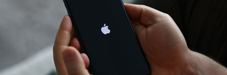 Tbilisi, Georgia - July 26, 2022: Person holds modern apple smartphone in handのeditorial素材