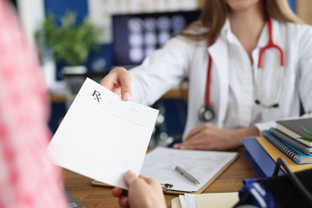Doctor giving a drug medical prescription to patient in clinic