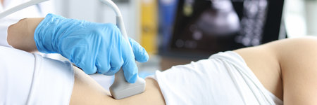 Doctor examines patient with prolapse of left kidney and spleen using ultrasound probe