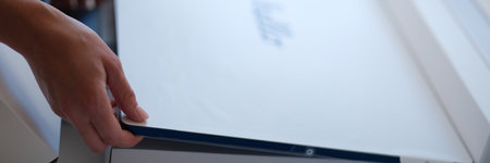 Unpacking new monitor covered with protective film closeup