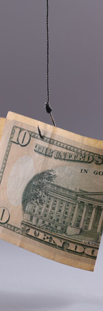 Ten dollars in air on gray background