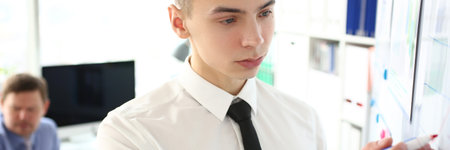 Business man conducts business training for colleagues in office closeup