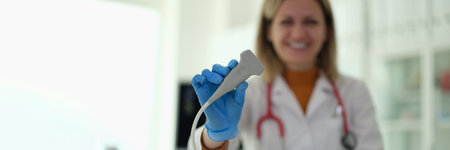 Doctor of ultrasound diagnostics holding probe in hands in clinic closeupの写真素材