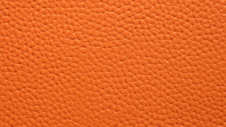 Texture of orange natural or artificial leather closeupの写真素材
