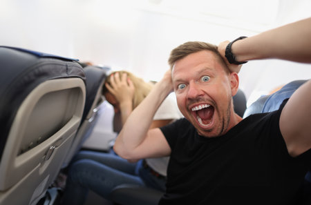 Man flying in airplane and screaming in fear