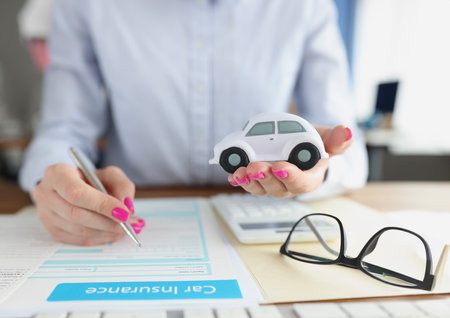 Client of insurance company takes out insurance for carの写真素材