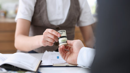 Businessman hands a cutlet out of money