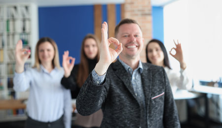 Group of business people showing hand gesture ok closeupの写真素材