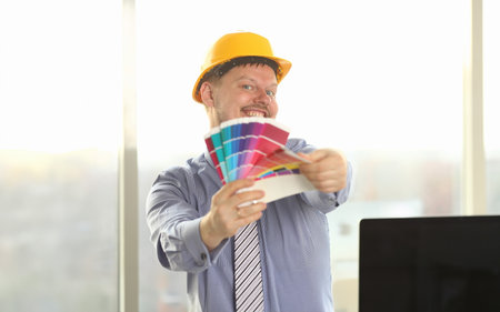 Portrait of Happy Male Designer Hold Color Paletteの写真素材