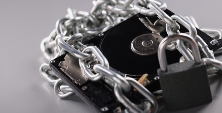 Computer hard drive is wrapped in chain