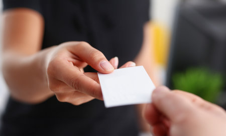 businesswoman give her business card to her new partner closeupの写真素材