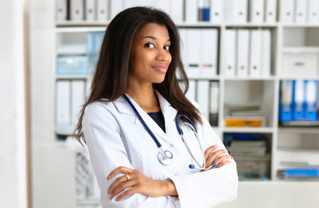 Beautiful black smiling female doctor portraitの写真素材