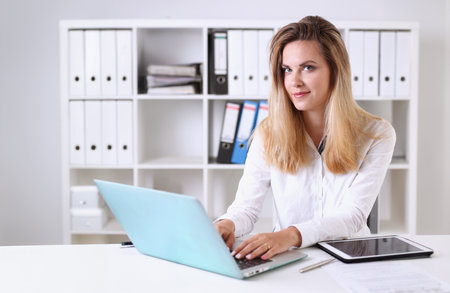 Beautiful business woman portrait in officeの写真素材