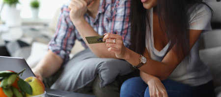 A married couple at home pays for purchases onlineの写真素材