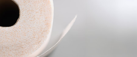 Close-up of a roll toilet paper on a gray backgroundの写真素材