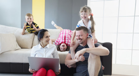 Happy smiling family spend time together in living roomの写真素材