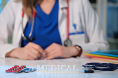 A Medical Professional Taking Care of Preparing a Prescription for Patient Health Needsの写真素材
