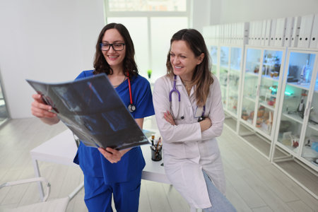 Doctors are analyzing an XRay collaboratively in a stateoftheart medical facility