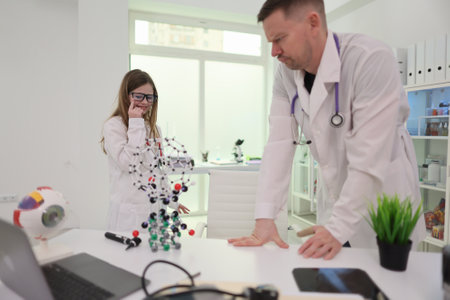 Healthcare Professionals Conducting Detailed Analysis of Molecular Structures in Laboratory Settingsの写真素材