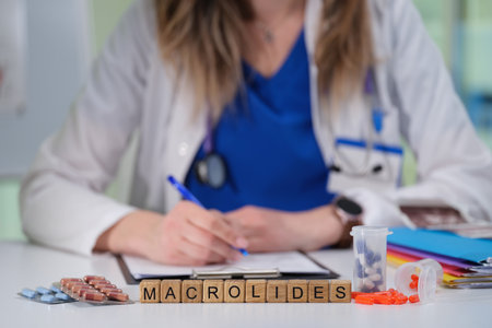 Healthcare professional composing and issuing a prescription specifically for macrolidesの写真素材