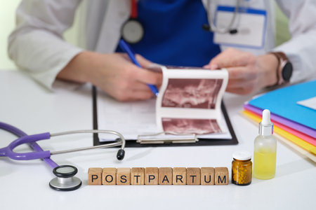 Postpartum Care A Doctor with Health Tools and Ultrasound Images offering supportの写真素材
