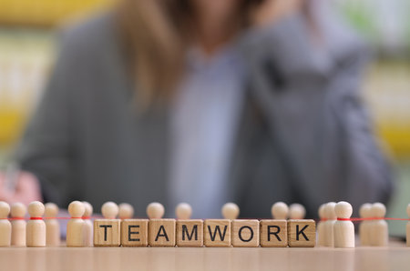 Concept of Teamwork Illustrated Through Various Figurines and Letter Blocks Togetherの写真素材