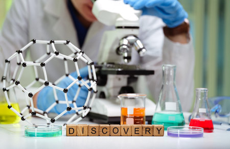 Groundbreaking scientific discovery made in lab using microscope and various chemicalsの写真素材