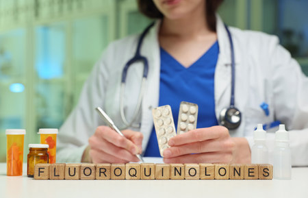 The Doctor is Writing a Prescription for Fluoroquinolones During a Medical Consultation Settingの写真素材
