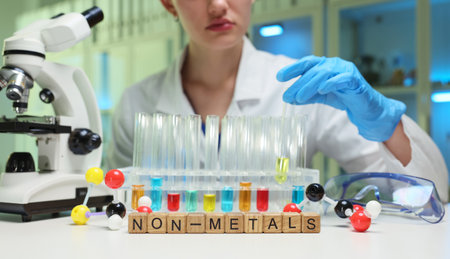 A scientist conducts nonmetal experiments in a lab, emphasizing research techniques and safety