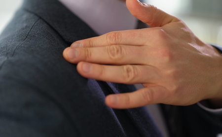 Elegant tailoring moment captured during a professional fitting session at a stylish boutique in the...