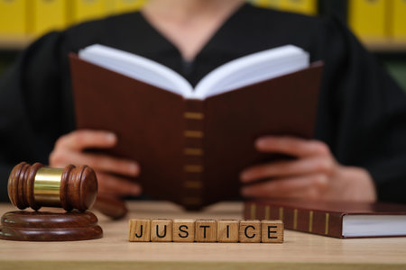 Gavel, book, and the quest for justice in a quiet courtroom setting