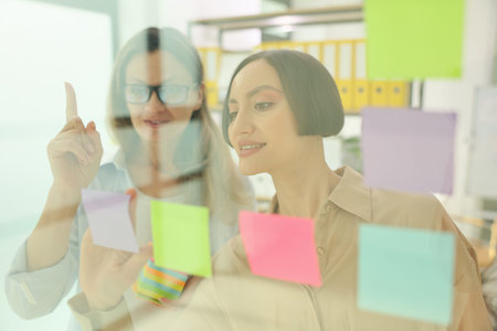 Creative brainstorming session with colorful sticky notes in a modern office