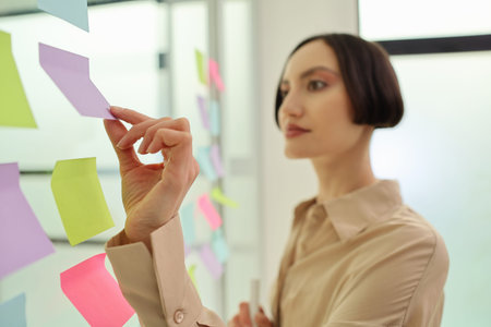 Creative brainstorming session sparks innovation with colorful sticky notes in a bright office space