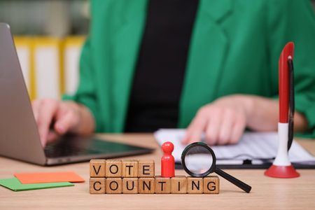 Vote counting in a modern office with tools and focus on accuracy during an important democratic...
