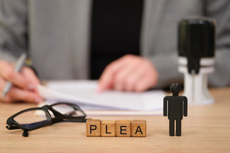 Courtroom scene with plea negotiation, focus on wooden blocks, black figure, and blurred background...