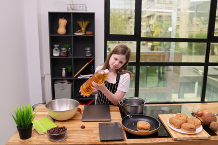 Young chef prepares a delicious meal in a bright, modern kitchen while exploring culinary skills