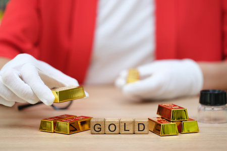 Collecting precious treasures in a vibrant setting with gold bars and playful scrabble tiles on the table