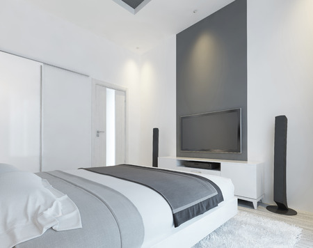 TV console with speakers in the modern bedroom in white and gray. Contemporary bedroom with sliding wardrobe and a media system on the wall. 3D renderの写真素材